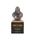 Maison Asrar Faris Al Arab Eau de Parfum, featuring a metallic bust of a veiled figure on a gold-plated base, set atop a black rectangular marble plaque with gold lettering.
