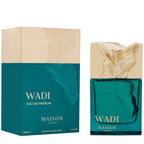 Maison Asrar Wadi Eau de Parfum shown with its retail box and the perfume bottle. The packaging and bottle feature a teal and beige color scheme with gold lettering and a sculptural gold cap.