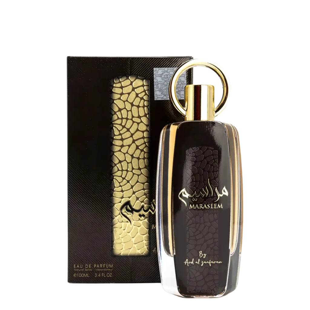 Perfume bottle with gold accents and 'Maraseem' branding next to its packaging on a white background