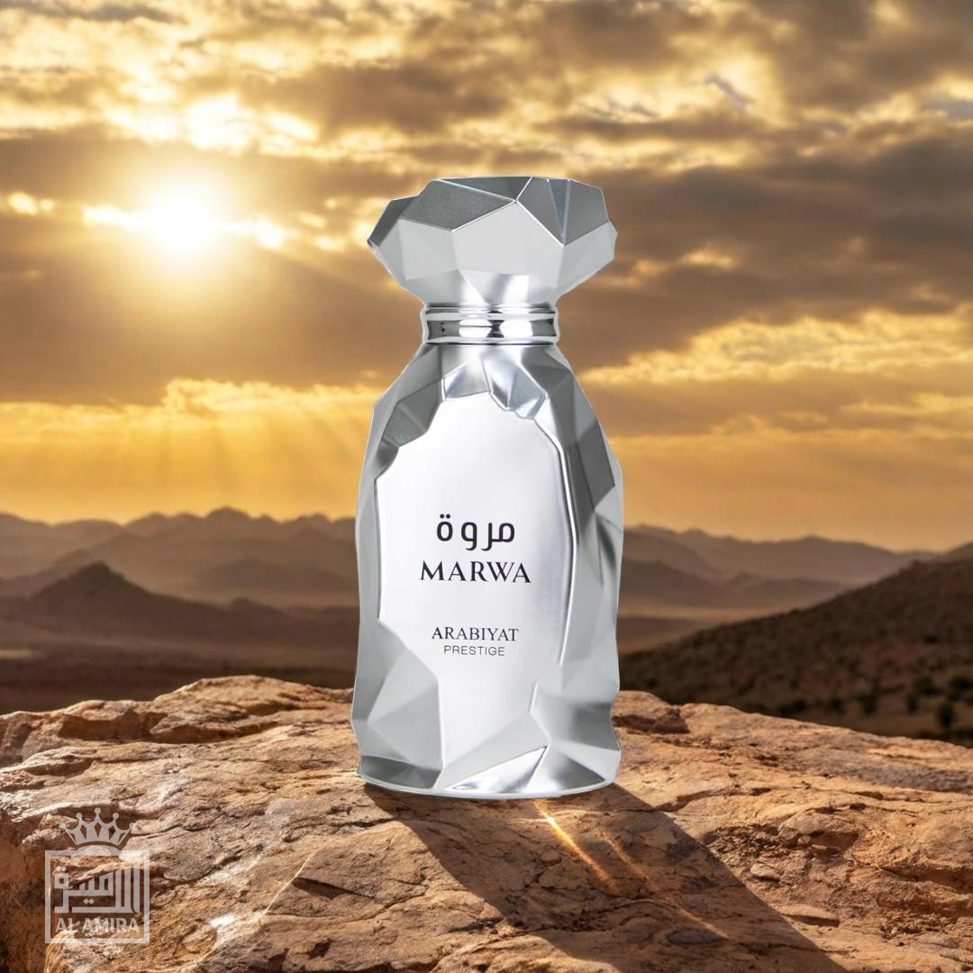 Marwa Arabian perfumes bottle by Arabiyat Prestige. Polished, shiny silver bottle with angular features. Desert mountaintop background. My Perfumes.