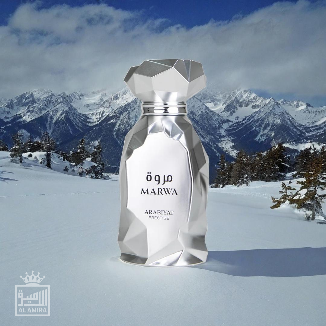 Marwa men's perfume	bottle by Arabiyat Prestige. Polished, shiny silver bottle with angular features. Snowy mountaintop background. My Perfumes.