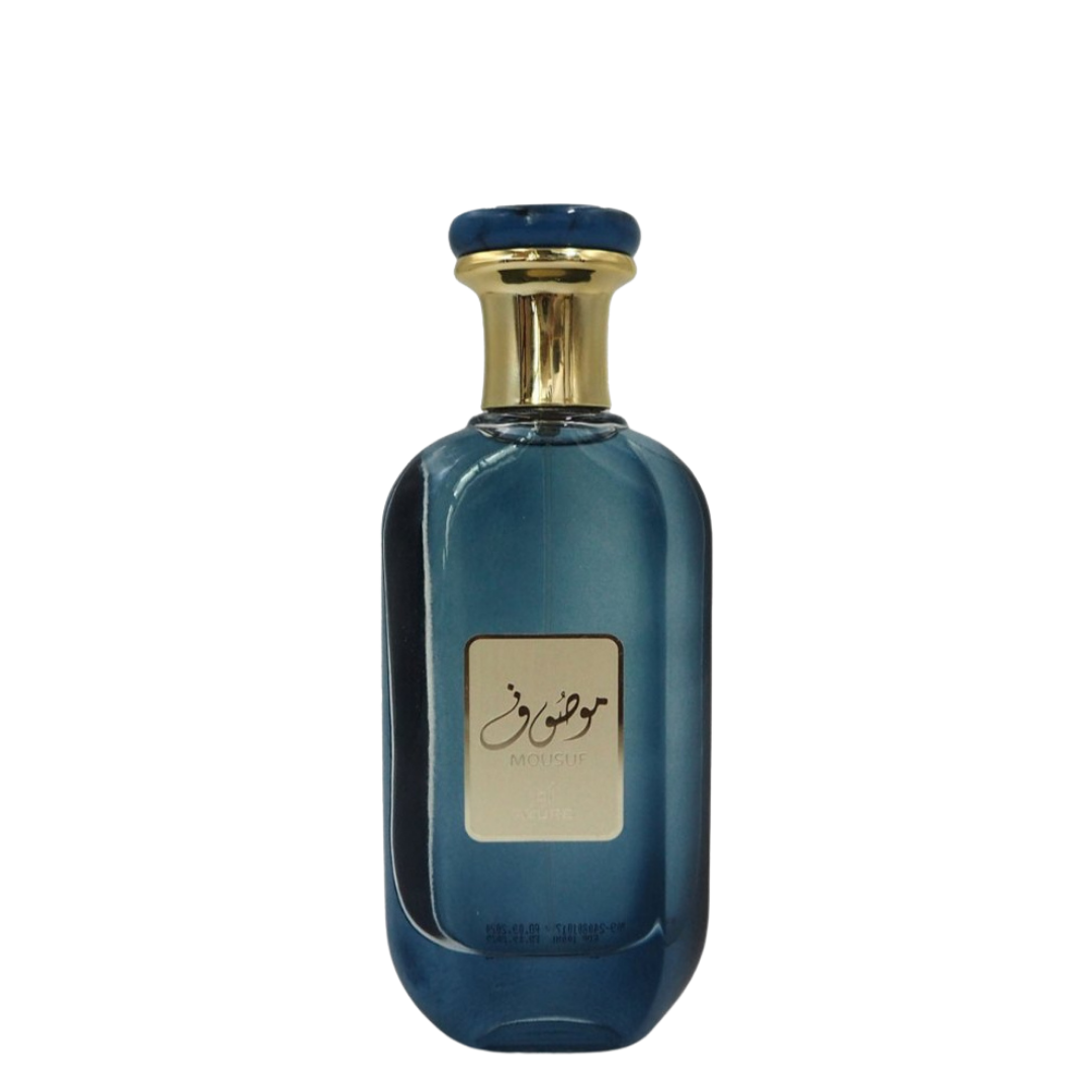 Mousuf Azure Eau de Parfum in elegant blue glass bottle with gold and blue cap, luxury Arabian fragrance for men and women. A blue perfume bottle with a gold cap, labeled with 'Mousuf Azure' by Ard Al Zaafaran. 