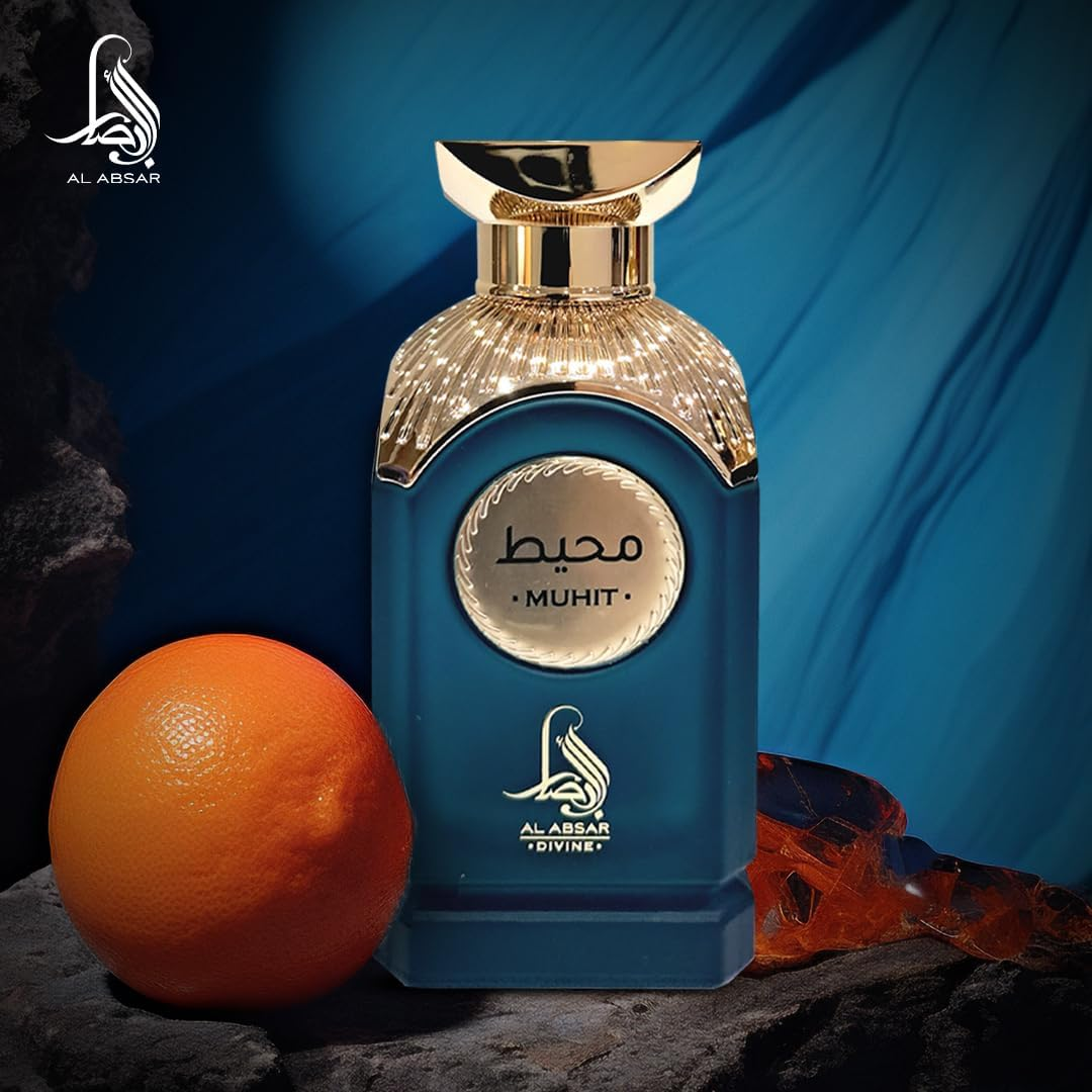 Blue perfume bottle with gold cap on a dark surface next to an orange, against a blue background.