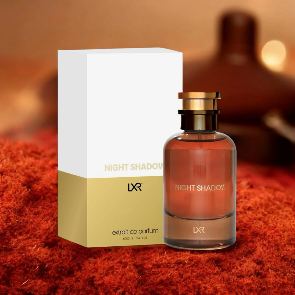 LXR Night Shadow perfume bottle and packaging on a textured surface with blurred background