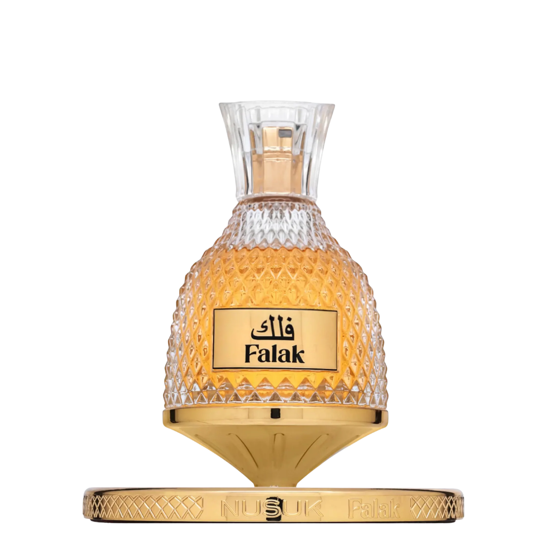 Perfume bottle with 'Falak' branding on a white background. Nusuk: Falak