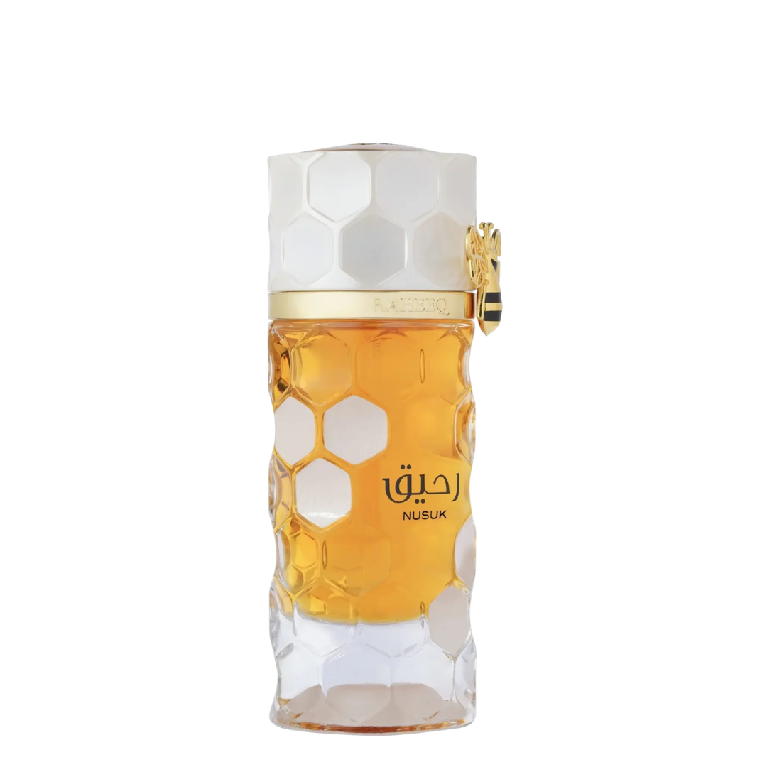 Perfume bottle with honeycomb design and gold accents on a white background. Nusuk: Raheeq