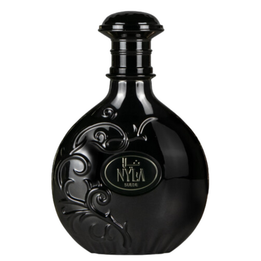 Arabiyat Prestige Nyla Suede Eau de Parfum in elegant black ornamental bottle, luxury oriental fragrance for men and women. A black bottle of Nyla Suede Perfume with decorative patterns and the brand name 'Nyla' displayed prominently on the label.