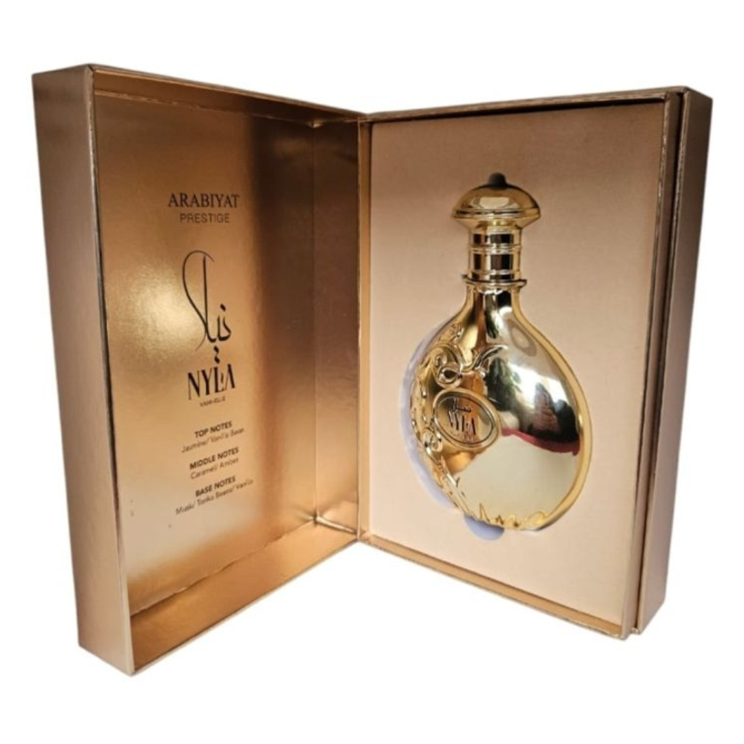 Nyla Vani-Elle by Arabiyat – Unboxed luxury perfume showcasing the ornate gold bottle inside premium gold presentation box with listed fragrance notes. Clone / dupe of / inspired by Giardini Di Toscana - Bianco Latte.