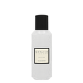 White perfume bottle with black cap and 'Octavia London Lacuna' label on a white background