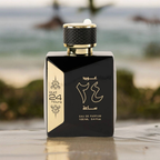 Black and gold perfume bottle with Arabic text on a blurred natural background