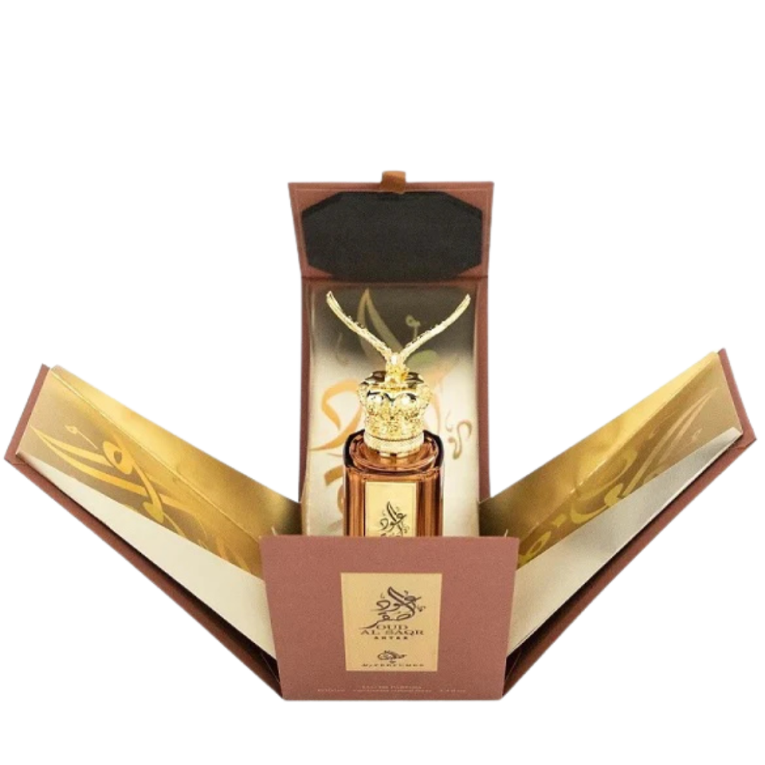 Oud Al Saqr Antar Eau de Parfum in open luxury presentation box with golden interior and Arabic calligraphy design.
