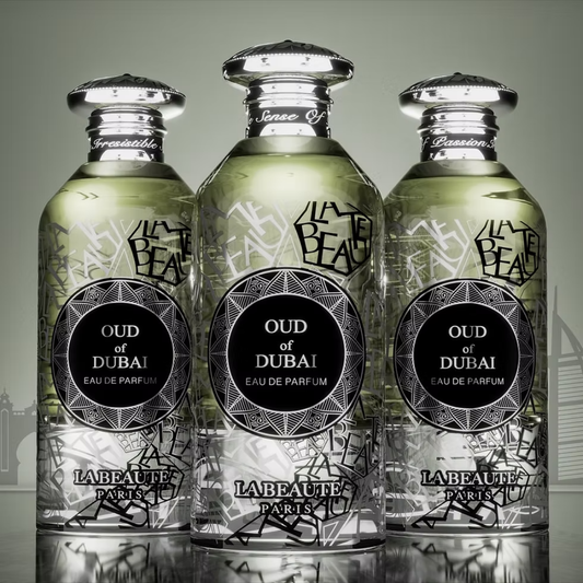 Three bottles of Labbeaute Oud of Dubai Eau de Parfum on a reflective surface with a gray background.