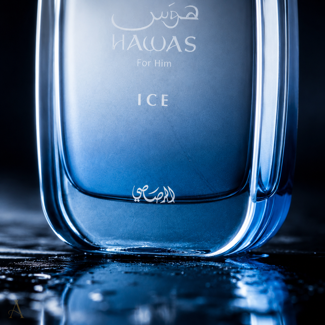 A close-up of a blue glass perfume bottle labeled 'HAWAS For Him ICE' with Arabic text, set against a dark reflective background.