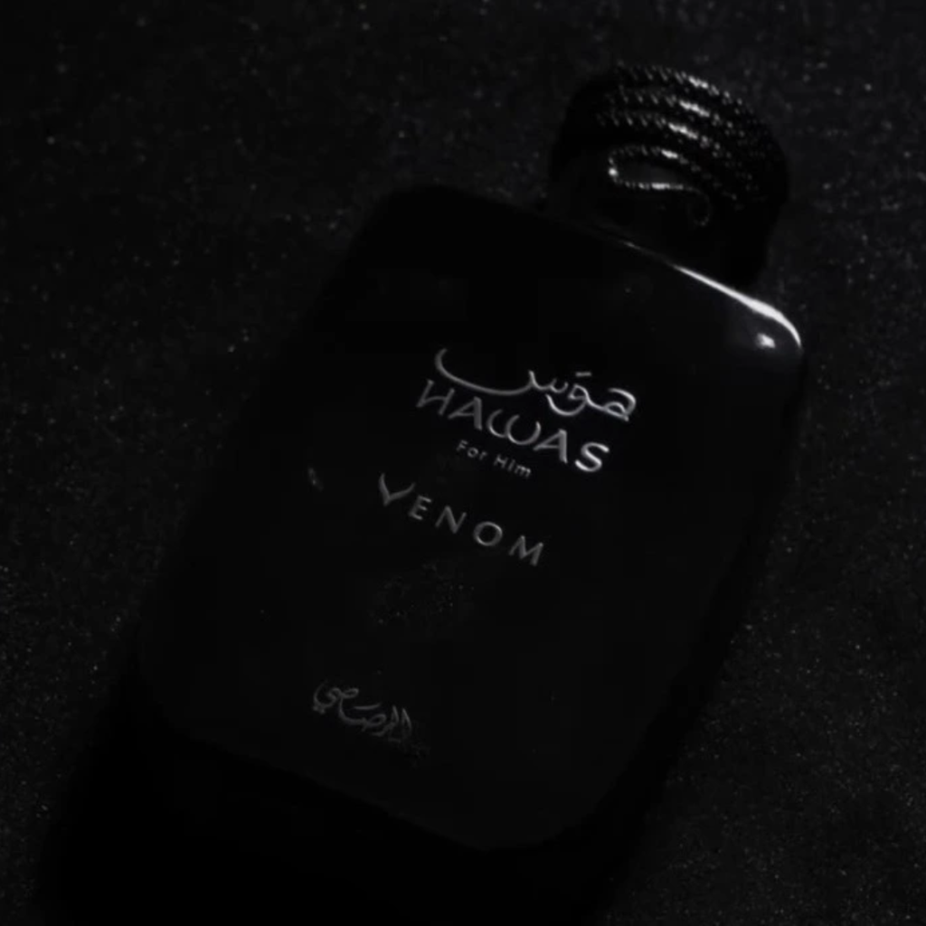 Black perfume bottle labelled 'Rasasi Hawas Venom' on a dark background