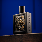 Black perfume bottle with lion emblem and 'RAYHAAN' branding on a blue background. Rayhaan Lion Mens Perfume
