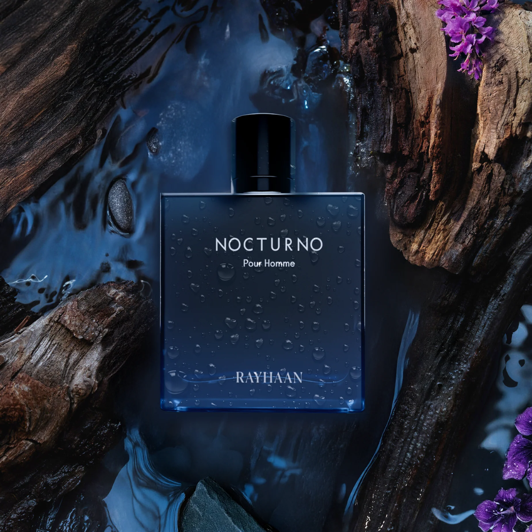 Perfume bottle labeled 'Nocturno' by Rayhaan on a natural background with water and wood.