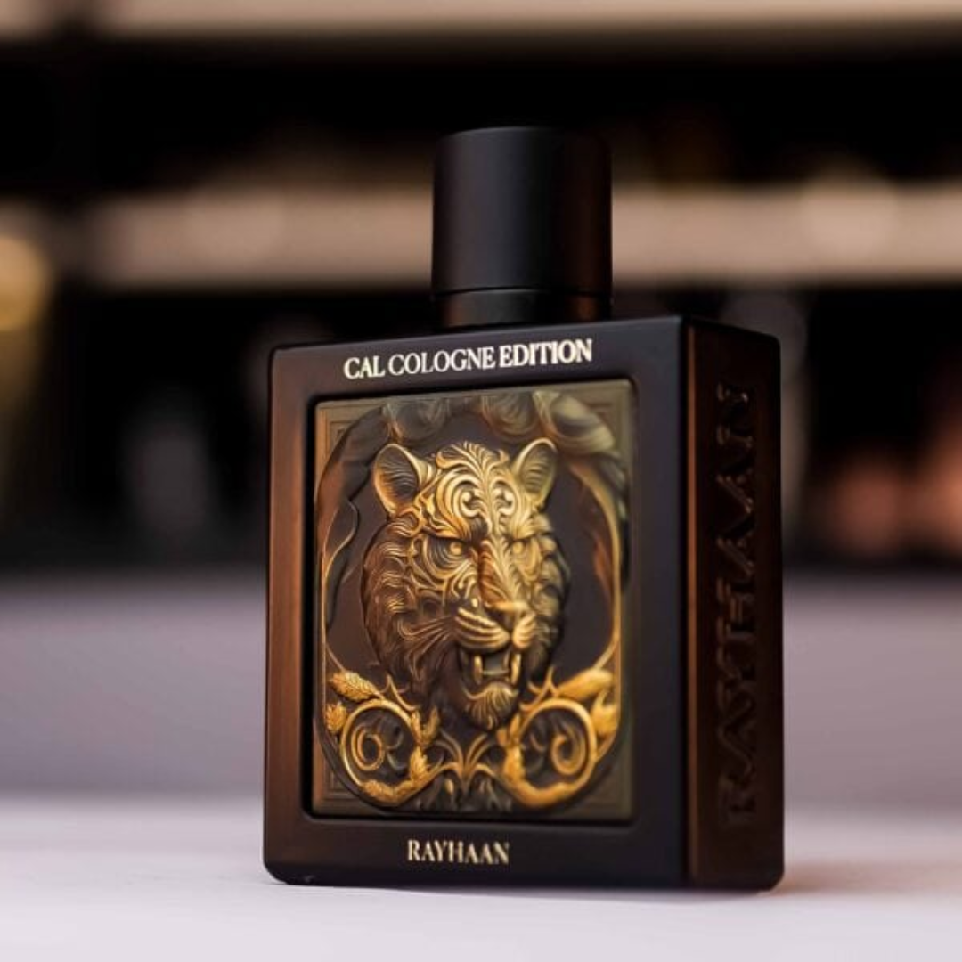 Perfume bottle with intricate design and 'RAYHAAN' branding on a blurred background. Rayhaan Tiger Cal Cologne Edition Mens Perfume