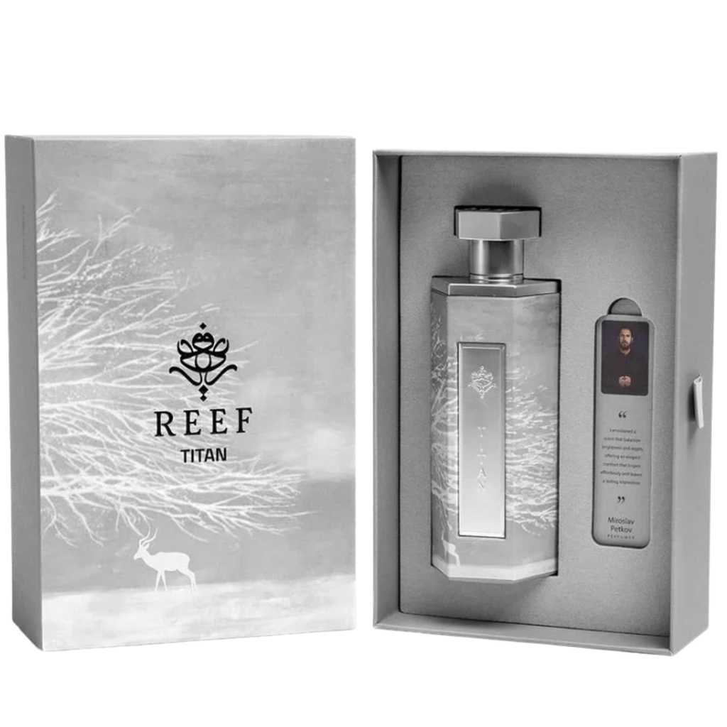 Silver perfume bottle with packaging featuring the 'REEF Titan' brand on a white background