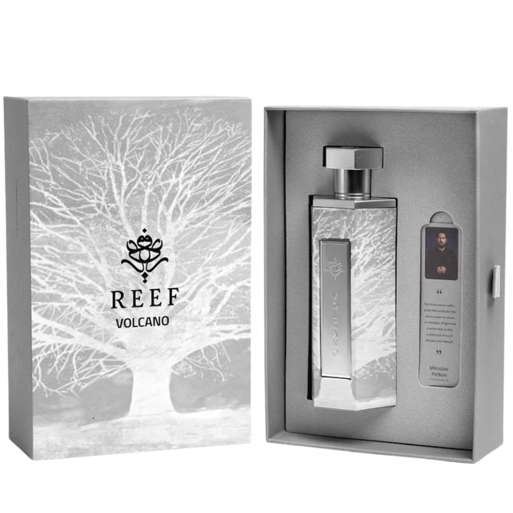 Silver perfume bottle with packaging featuring the 'REEF Volcano' brand on a white background