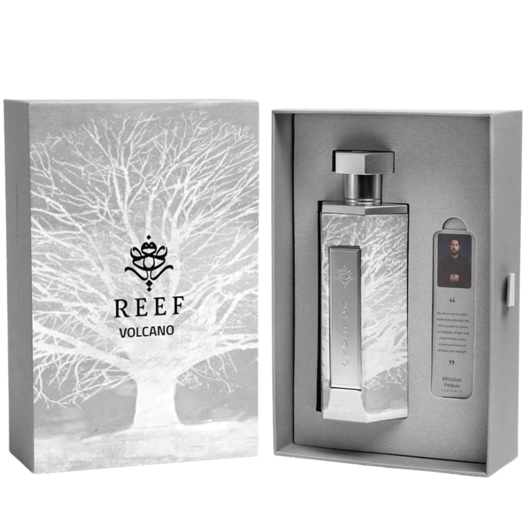 Silver perfume bottle with packaging featuring the 'REEF Volcano' brand on a white background