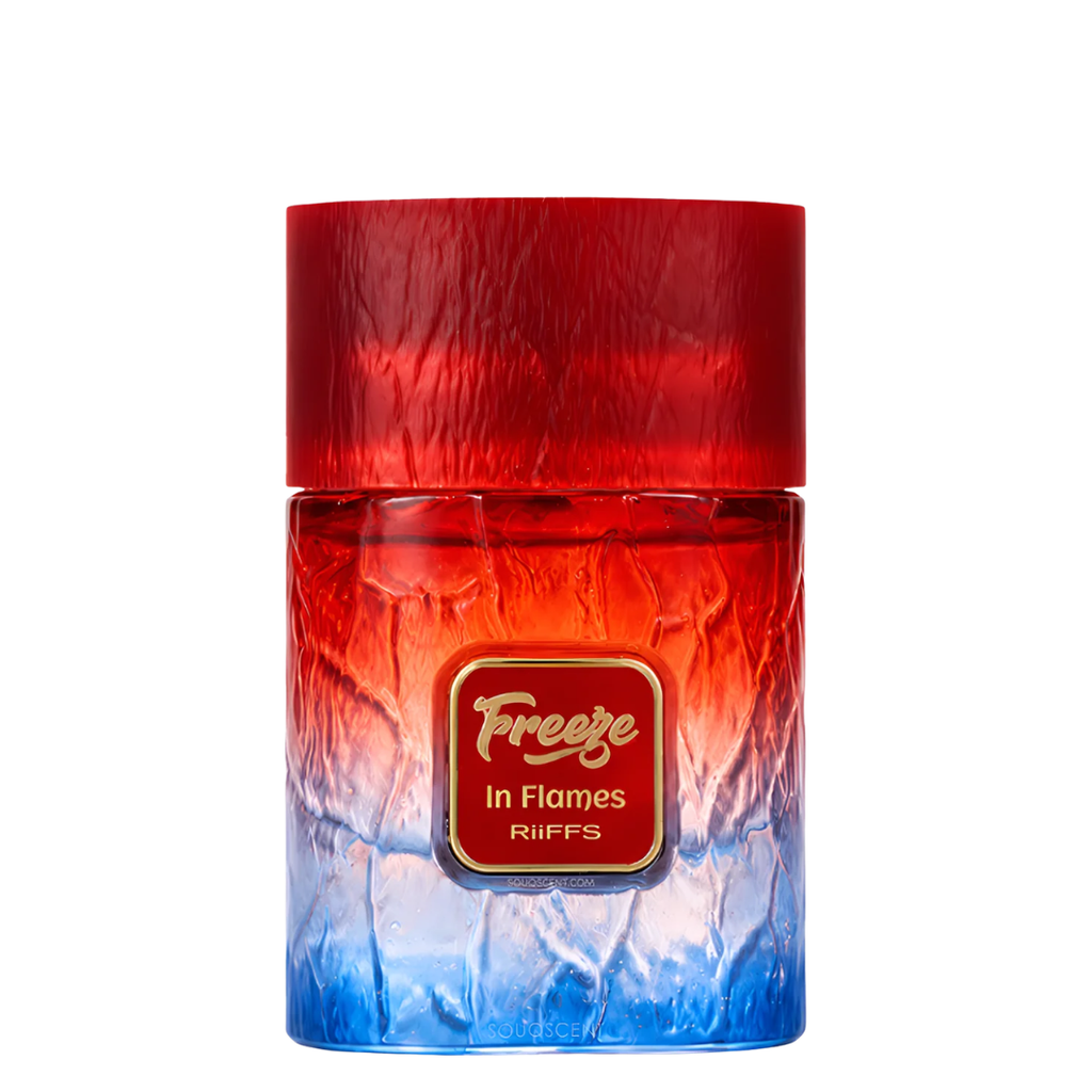 A cylindrical bottle of Freeze In Flames Riffs fragrance, featuring a textured red-to-blue gradient design with a gold label in the center.