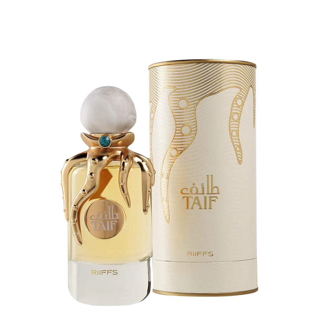 Riffs Taif perfume bottle with a gold octopus-shaped cap and pale amber liquid, shown next to its cream and gold cylindrical box on a white background.