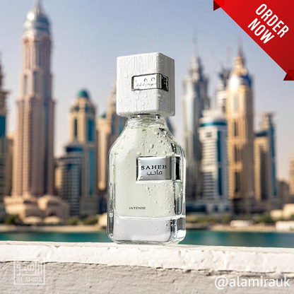 Perfume bottle labeled 'SAHEB' with a city skyline in the background. Ard Al Zaafaran. Clone / dupe of Imagination by Louis Vuitton.