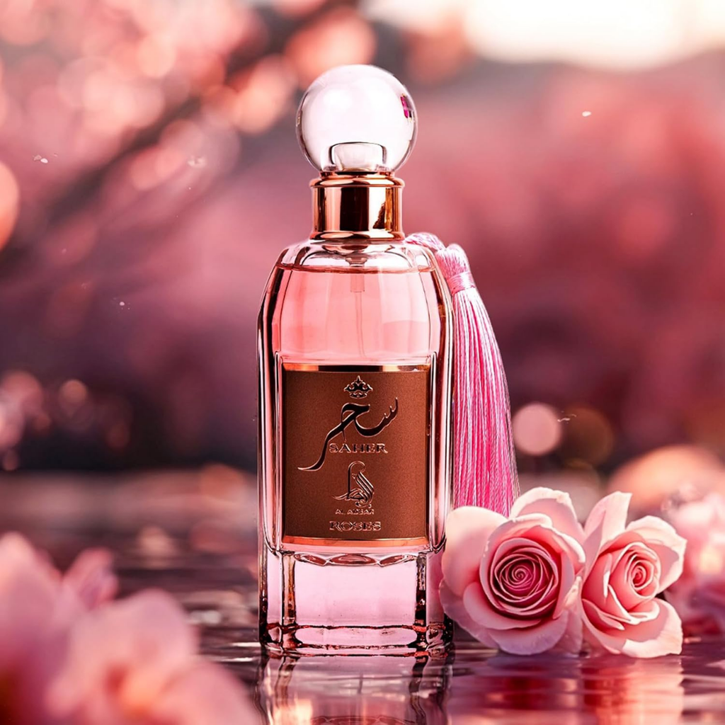 Perfume bottle with a pink ribbon and pink flowers on a blurred background. Saher Roses by Al Absar Womens Perfume