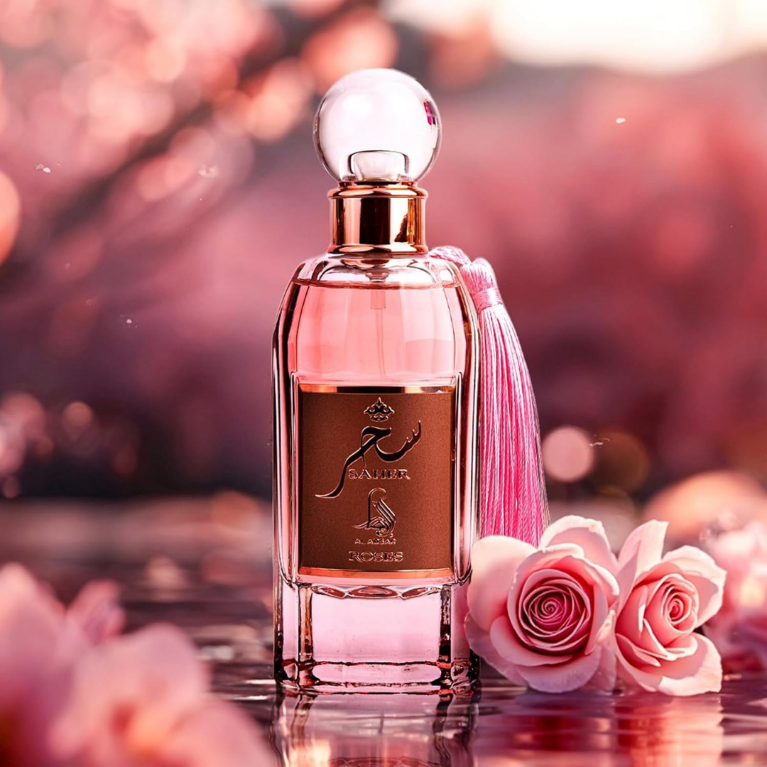 Perfume bottle with a pink ribbon and pink flowers on a blurred background. Saher Roses by Al Absar Womens Perfume