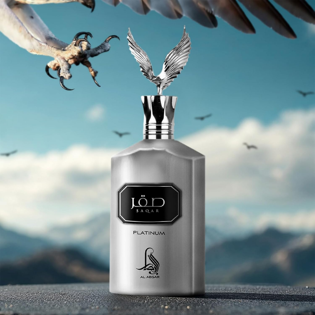 Silver perfume bottle with angelic design on top against a mountain and sky background