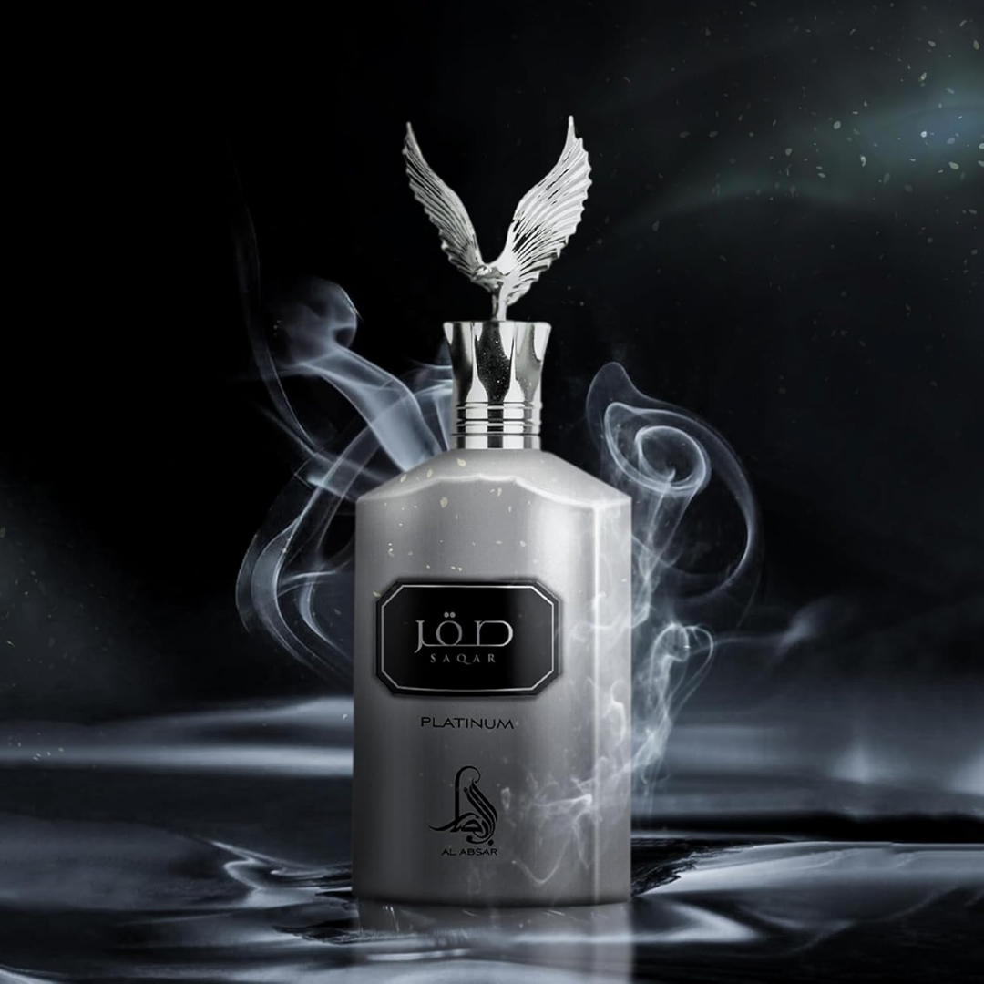 Perfume bottle with a decorative winged cap on a dark background