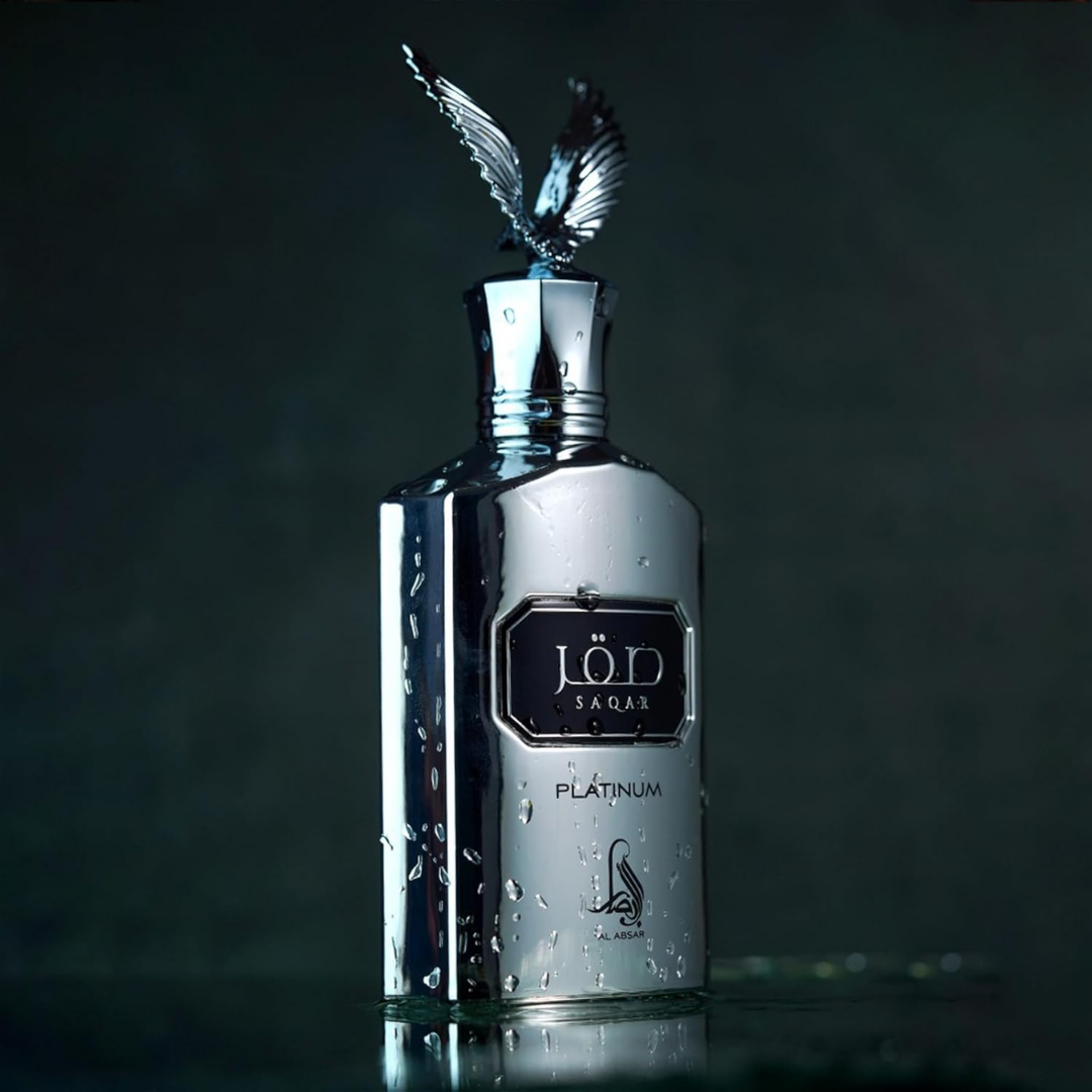 Silver bottle with decorative cap on a dark background