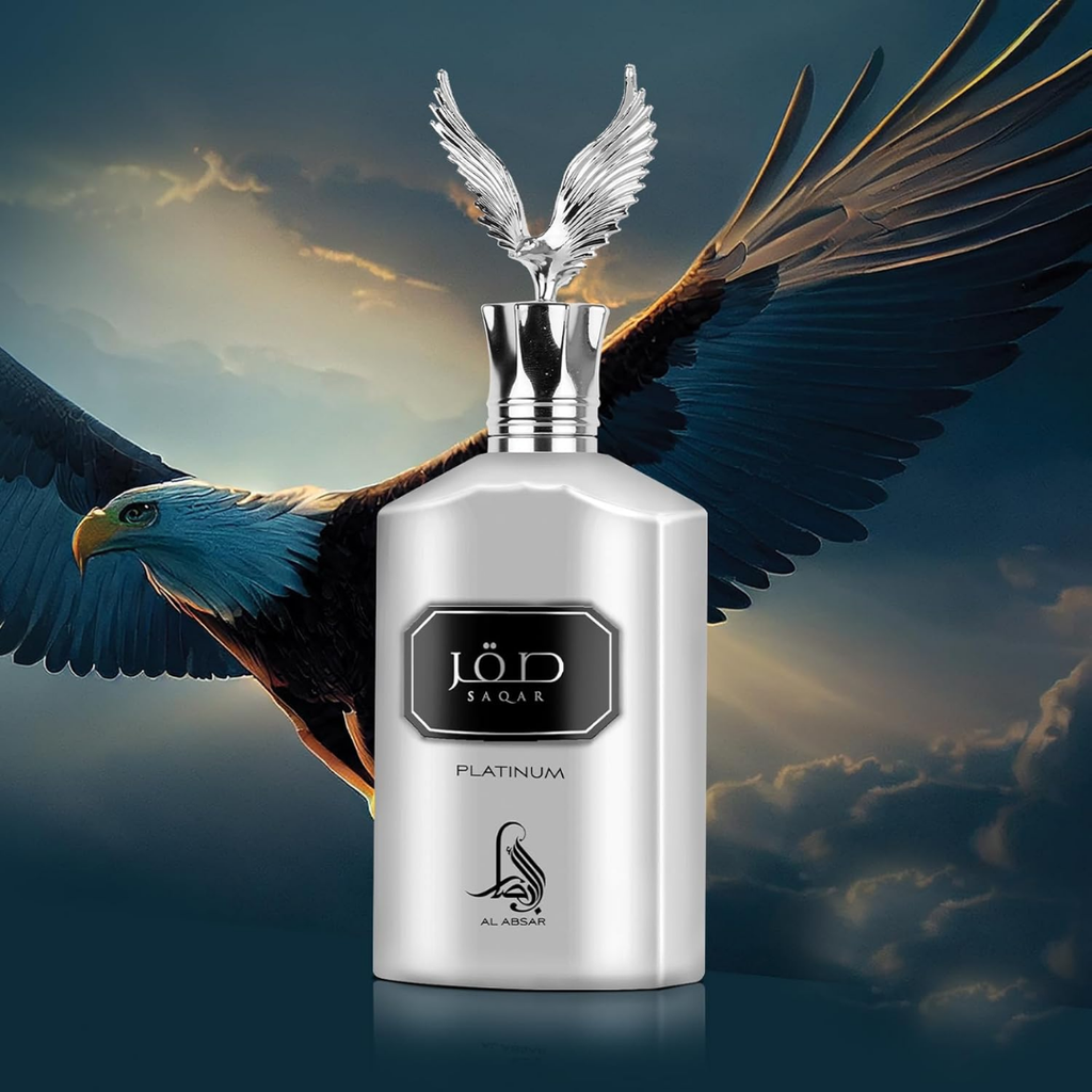 Silver perfume bottle with eagle wings against a cloudy sky