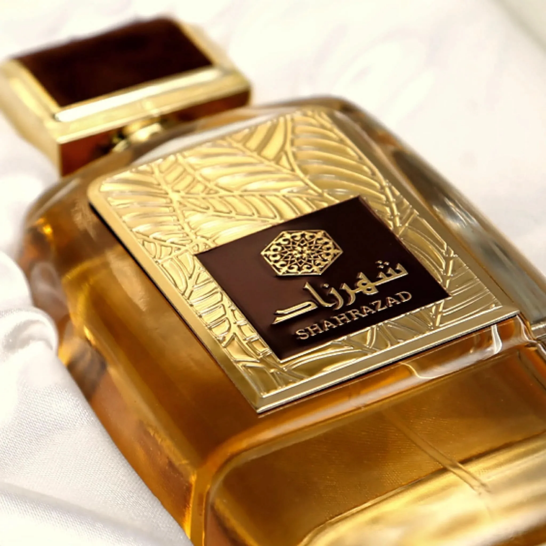 Gold perfume bottle with 'Shahrazad' branding on a white background. Shahrazad by Ard Al Zaafaran Unisex Perfume