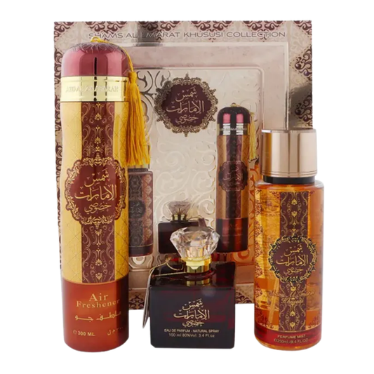 A gift set by Ard Al Zaafaran, including a 100ml EDP perfume bottle, a 250ml perfume mist spray, and a 300ml air freshener, all with the label 'Shams Al Emarat Khususi'.