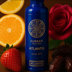 Surrati Atlantis perfume bottle in a close-up composition with decorative citrus, roses and fruit.