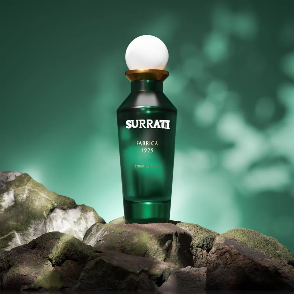 Green Surrati fabrica 1929 bottle on a rock with a green background