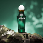 Surrati Fabrica 1929 perfume bottle on stone against a green background.