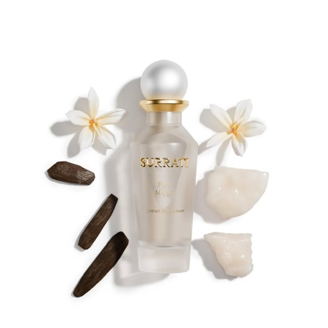 Surrati perfume bottle with flowers and rocks on a white background