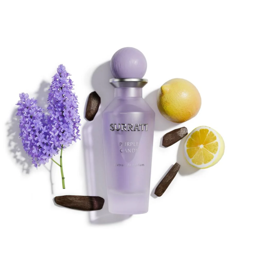 Purple Surrati perfume bottle with lavender, lemon, and wooden elements on a white background