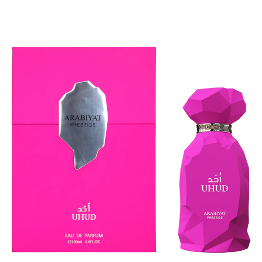 Pink perfume bottle and packaging on a white background. Uhud by Arabiyat Prestige Womens Perfume