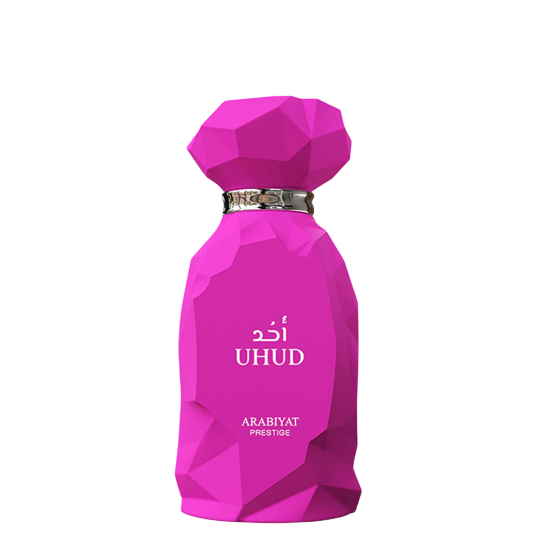 A pink, faceted bottle of Uhud perfume by Arabiyat Prestige with Arabic script on the front. Uhud by Arabiyat Prestige Womens Perfume