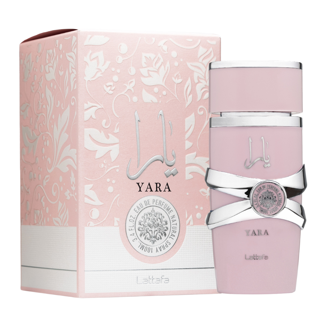 A bottle of Yara Eau de Parfum by Lattafa, featuring a pink hue with a silver-colored cap and label design. Clone / dupe of / inspired by Dior - Poison Girl womens fragrance. Lattafa Yara Eau de Parfum 100ml bottle and pink floral embossed box with silver Arabic calligraphy, feminine fragrance with sweet, vanilla, and tropical accords.