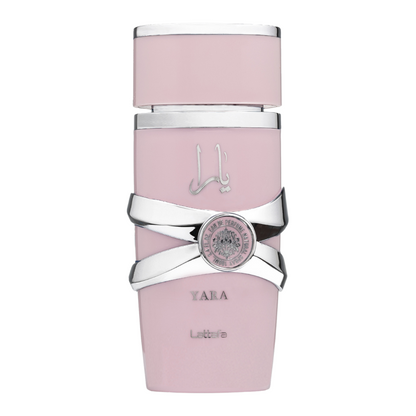 A bottle of Yara Eau de Parfum by Lattafa, featuring a pink hue with a silver-colored cap and label design. Clone / dupe of / inspired by Dior - Poison Girl women's perfume. Lattafa Yara perfume bottle in soft pink with silver accents and lion emblem, exuding elegance and femininity.