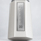 Reef 33 White close-up of the silver front plaque on the white perfume bottle.