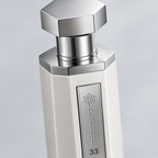 Reef 33 White overhead close-up of the silver cap and bottle shoulder.