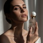 Model holding the Surrati Pur Musk perfume bottle.
